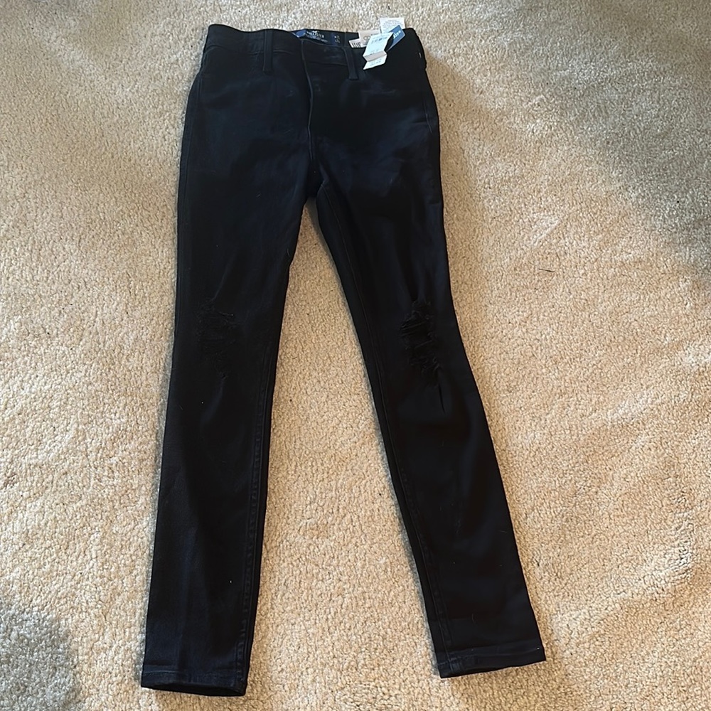 Brand new Hollister black ripped jeans W25, L24